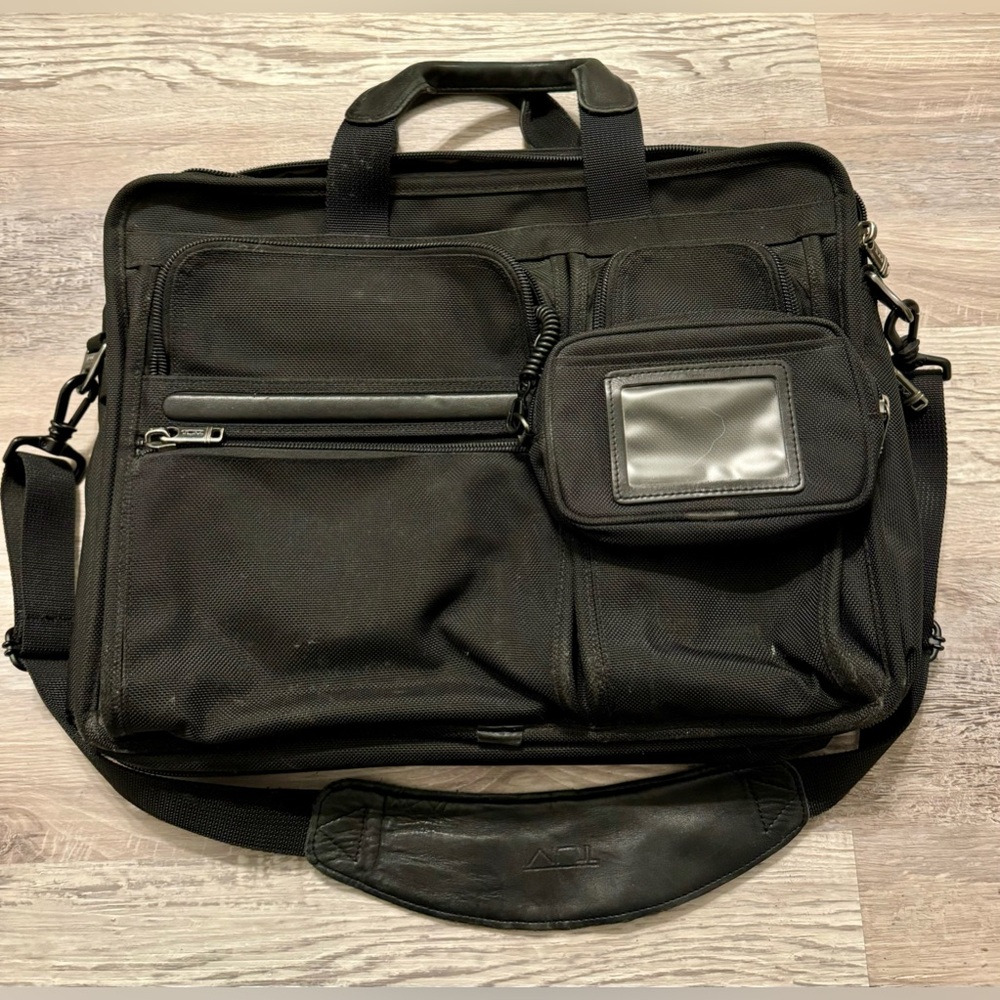 TUMI black laptop carrier bag. It has wallet inside.  It has various - Picture 6 of 15